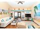 Bright living room featuring vaulted ceilings, modern furnishings, and sliding glass doors at 2225 Cypress Ct # 2C, Tavares, FL 32778