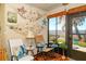 Enjoy tranquil water views from this cozy lanai decorated with a coastal theme and comfortable seating at 2225 Cypress Ct # 2C, Tavares, FL 32778