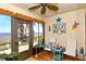 The enclosed lanai offers serene water views with charming beach themed decorations, creating a relaxing atmosphere at 2225 Cypress Ct # 2C, Tavares, FL 32778
