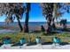 Picturesque waterfront view with lush greenery and a tidy patio at 2225 Cypress Ct # 2C, Tavares, FL 32778