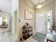 Welcoming foyer featuring tile flooring and a decorative rug, setting a warm and inviting tone at 24002 Robinwood St, Leesburg, FL 34748