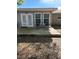 Outdoor back patio with modern lounge chairs, ideal for relaxing and entertaining at 2416 Briarwood Ln, Eustis, FL 32726