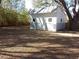 Backyard shed with double doors and windows offering extra storage space at 2416 Briarwood Ln, Eustis, FL 32726