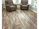 Open concept living room featuring hardwood floors at 2416 Briarwood Ln, Eustis, FL 32726