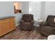 Open concept living room with hardwood floors and large windows at 2416 Briarwood Ln, Eustis, FL 32726