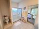Bathroom with a glass shower, toilet and bright white tiles at 25527 Oak Aly, Leesburg, FL 34748