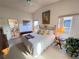 Cozy bedroom with a large window, white walls, vaulted ceiling and neutral carpet at 25527 Oak Aly, Leesburg, FL 34748