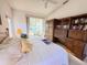 Spacious bedroom with custom built-ins and a view to the outdoor space at 25527 Oak Aly, Leesburg, FL 34748
