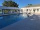 Community pool featuring a Gathering and lounge chairs in a well-maintained outdoor space at 25527 Oak Aly, Leesburg, FL 34748