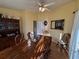 Bright dining area features a wooden table and a built-in china cabinet at 25527 Oak Aly, Leesburg, FL 34748