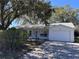 Charming single-story home with a well-maintained lawn and attached one car garage at 25527 Oak Aly, Leesburg, FL 34748