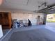 Spacious two car garage with storage shelves and side entry at 25527 Oak Aly, Leesburg, FL 34748