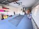 Well-organized garage with ample storage shelves and storage containers at 25527 Oak Aly, Leesburg, FL 34748