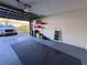 Spacious garage, offering parking and storage with well-lit interior at 25527 Oak Aly, Leesburg, FL 34748