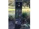 Golf course marker post featuring distances at The Plantation Golf & Country Club in Leesburg, Florida at 25527 Oak Aly, Leesburg, FL 34748