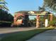 Brick guard house at the entrance of the community for residents and visitors at 25527 Oak Aly, Leesburg, FL 34748