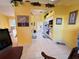 Bright open floorplan with kitchen featuring white cabinetry, and views to the living area at 25527 Oak Aly, Leesburg, FL 34748