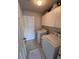 Functional laundry room with washer, dryer, cabinets, and tile flooring at 25527 Oak Aly, Leesburg, FL 34748