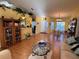Inviting living room showcases laminate floors, and open access to dining room and kitchen at 25527 Oak Aly, Leesburg, FL 34748