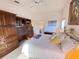 Bright primary bedroom with en-suite bathroom and decorative wood bookcase at 25527 Oak Aly, Leesburg, FL 34748