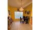 Home office space with natural light, tile floors, desk and bookshelf at 25527 Oak Aly, Leesburg, FL 34748