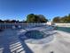 Relaxing pool area with a jacuzzi and sun loungers surrounded by well-maintained fencing at 25527 Oak Aly, Leesburg, FL 34748