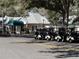 Plantation Oaks Restaurant exterior view with golf cart parking at 25527 Oak Aly, Leesburg, FL 34748