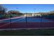 Outdoor tennis courts with enclosed fencing ready for recreational play at 25527 Oak Aly, Leesburg, FL 34748