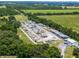 Expansive aerial view of boat and RV storage lot surrounded by lush green landscape at 26636 Evert St, Leesburg, FL 34748