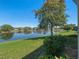 Expansive backyard view showcases the beautiful water feature at 26636 Evert St, Leesburg, FL 34748