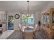 Elegant dining area with lake view, featuring a display cabinet and neutral decor at 26636 Evert St, Leesburg, FL 34748