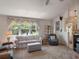 Cozy living room features large window with bright, natural light at 26636 Evert St, Leesburg, FL 34748