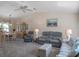 Cozy living room with neutral colors, carpet flooring, and comfortable furniture at 26636 Evert St, Leesburg, FL 34748