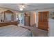 A cozy main bedroom with generous storage and a view to a home office at 26636 Evert St, Leesburg, FL 34748