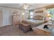 Cozy main bedroom with a soft color palette and view to ensuite bath at 26636 Evert St, Leesburg, FL 34748