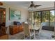 Sunroom with views of the lake, dining table and side seating at 26636 Evert St, Leesburg, FL 34748