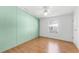 Cozy bedroom features wood floors and a ceiling fan at 27 Florence Blvd, Debary, FL 32713