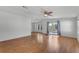 Bright living room with wood flooring, neutral walls, and a sliding door at 27 Florence Blvd, Debary, FL 32713