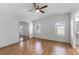 Spacious main bedroom with wood floors, ceiling fan, and sliding closet doors at 27 Florence Blvd, Debary, FL 32713