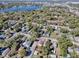 Overhead aerial shot of the property in a neighborhood near a serene lake and lush greenery at 2741 S Brown Ave, Orlando, FL 32806