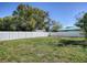 Wide shot of a large fenced backyard with green grass at 2741 S Brown Ave, Orlando, FL 32806