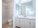 Bathroom featuring a white vanity with white cabinets, a tub, and neutral walls at 2741 S Brown Ave, Orlando, FL 32806