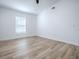 Spacious bedroom with a ceiling fan, bright natural light, and neutral-toned walls at 2741 S Brown Ave, Orlando, FL 32806