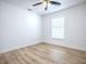 Bedroom featuring a ceiling fan, neutral walls, and a bright window at 2741 S Brown Ave, Orlando, FL 32806