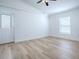 Bedroom featuring neutral walls, ceiling fan, and a bright window at 2741 S Brown Ave, Orlando, FL 32806