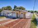 Charming home with a quaint front yard, attractive wood accents and driveway at 2741 S Brown Ave, Orlando, FL 32806