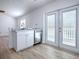 Bright kitchen with stainless steel appliances, white cabinets, and access to the outdoor area at 2741 S Brown Ave, Orlando, FL 32806