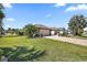 Attractive home featuring a manicured lawn, paved driveway and two-car garage at 2947 Rain Lily Loop, The Villages, FL 32163