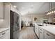 Bright and airy kitchen featuring stainless steel appliances, modern cabinetry and a comfortable breakfast nook at 2947 Rain Lily Loop, The Villages, FL 32163