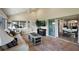 Comfortable living room area, features tile floors, vaulted ceilings, seamless flow to dining and kitchen at 2947 Rain Lily Loop, The Villages, FL 32163